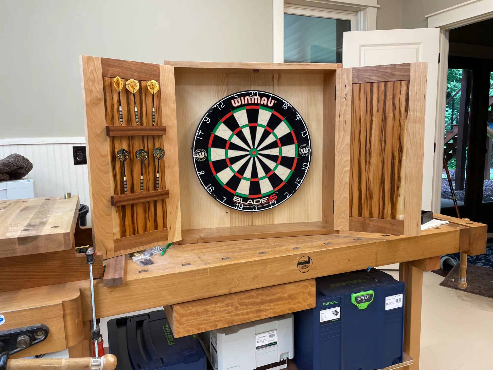 Dartboard cabinet open showing interior