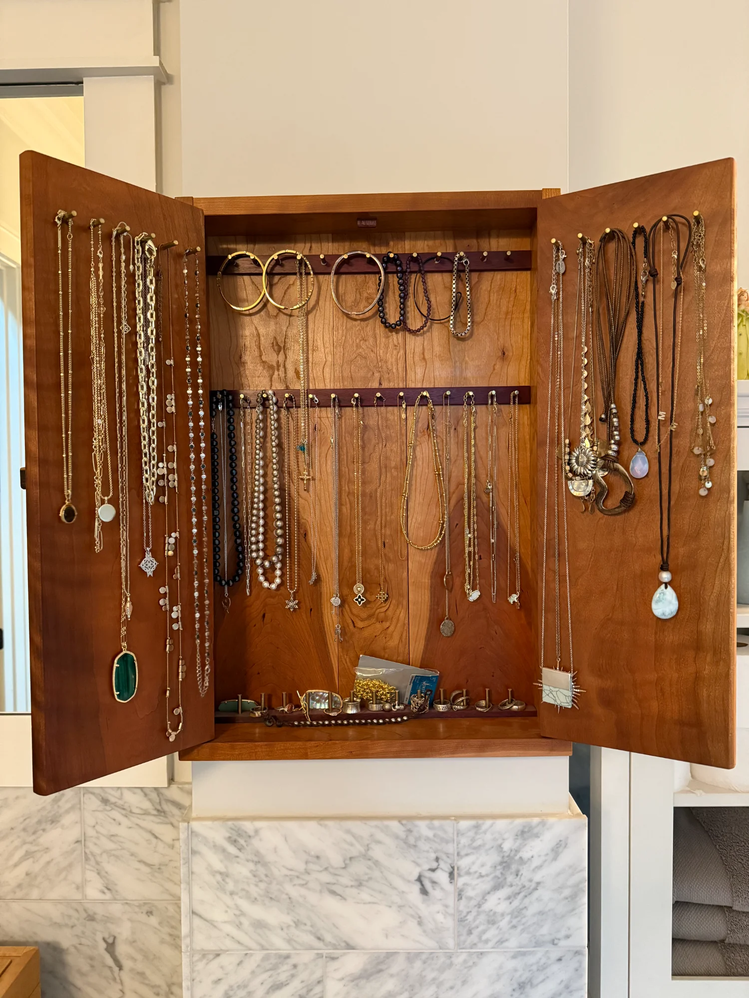 Jewelry cabinet interior organization